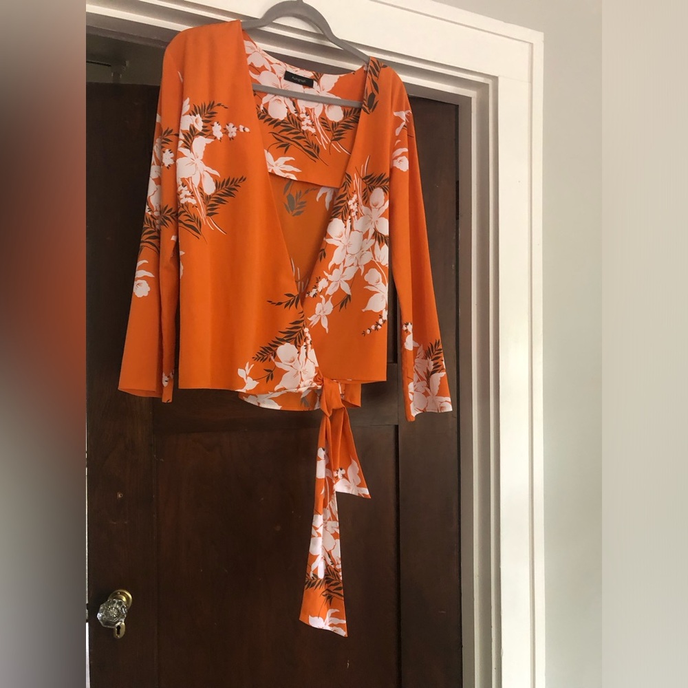 Chic floral wrap top with long sleeves. Very nice with a white cami underneath.